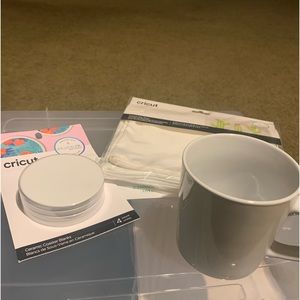 Circuit supplies. (4) coasters, (2) makeup cases and (1) mug